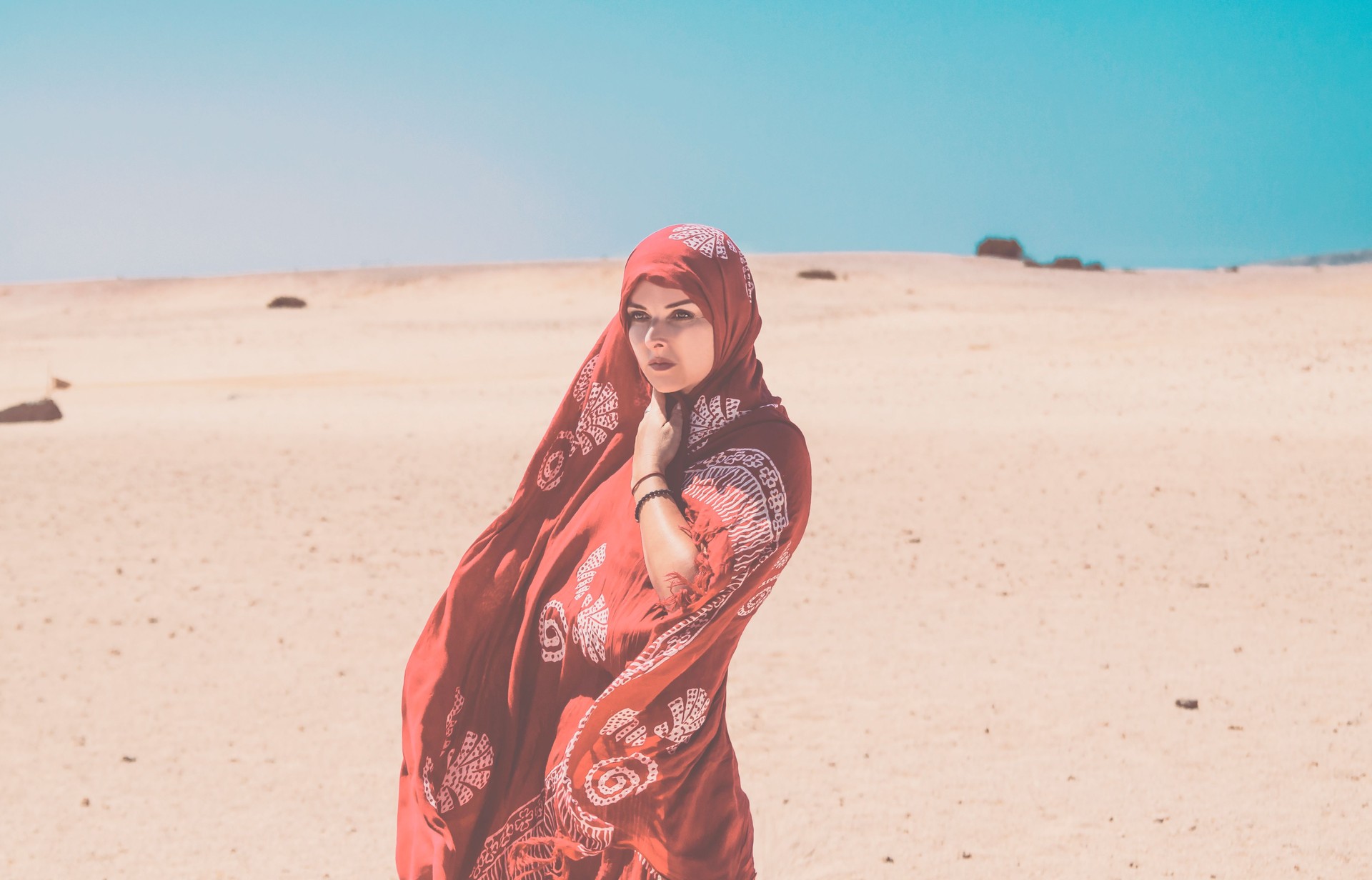 Arabian woman portrait walking in desert